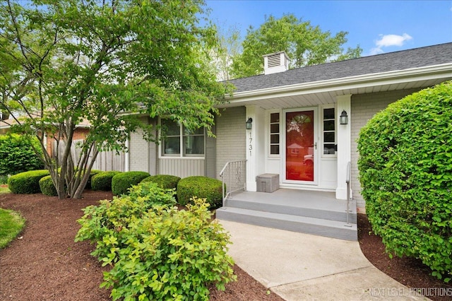 1731 Garfield Ave, Aurora, IL 60506 - property entrance featuring brick siding and a chimney