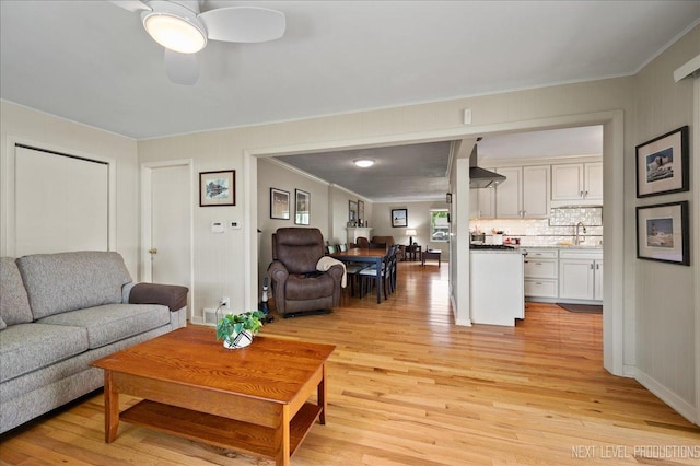 1731 Garfield Ave, Aurora, IL 60506 - living area featuring crown molding, light wood finished floors, and a ceiling fan
