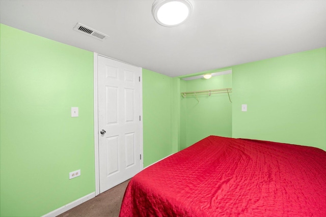 bedroom with carpet floors and a closet