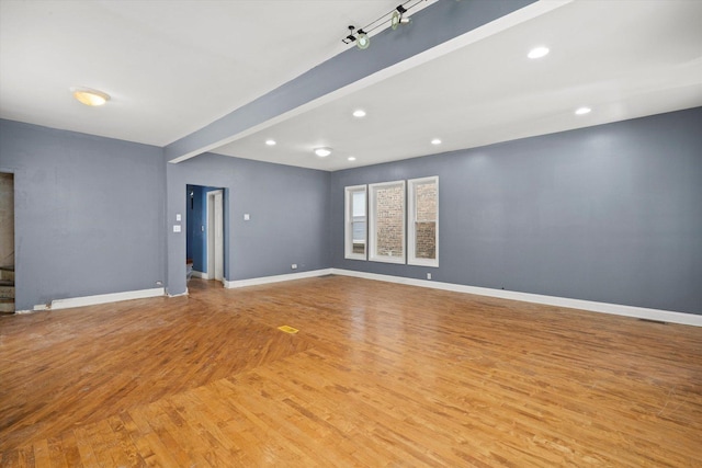 spare room featuring light wood-style flooring and recessed lighting