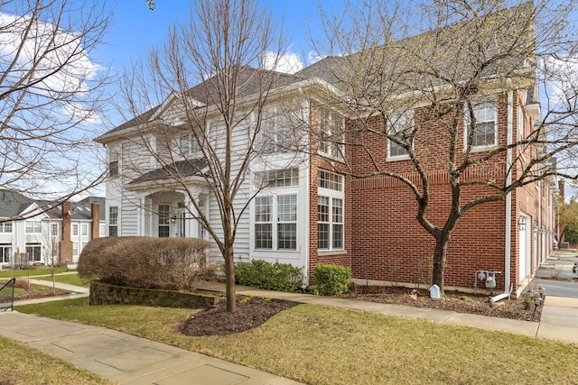 119 Allerton Dr, Schaumburg, IL 60194 - view of front facade with a front lawn and brick siding