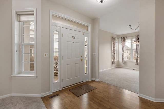 119 Allerton Dr, Schaumburg, IL 60194 - carpeted entrance foyer featuring baseboards and wood finished floors