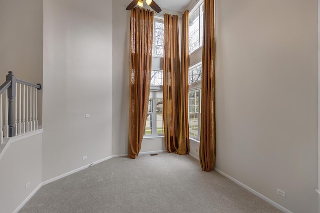 119 Allerton Dr, Schaumburg, IL 60194 - carpeted empty room with baseboards, a high ceiling, and a ceiling fan