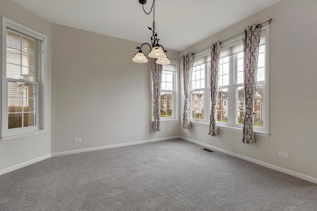 119 Allerton Dr, Schaumburg, IL 60194 - empty room with carpet, baseboards, and a chandelier