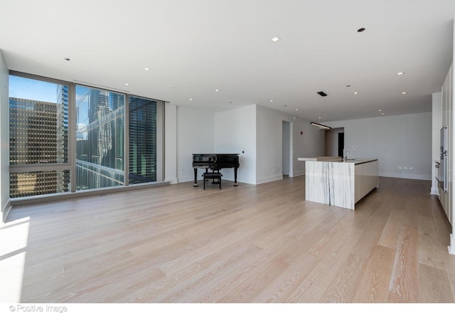 363 E Wacker Dr Unit 1903, Chicago, IL 60601 - living area featuring light wood-style floors, recessed lighting, and baseboards