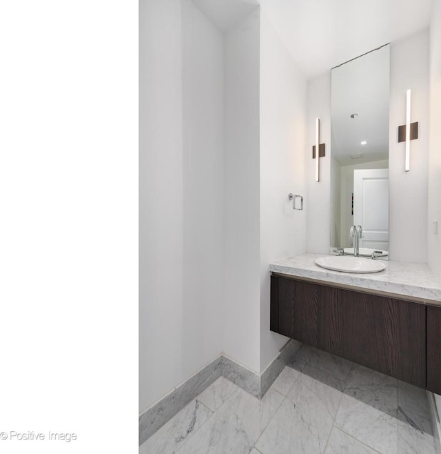 363 E Wacker Dr Unit 1903, Chicago, IL 60601 - bathroom featuring marble look tiles, baseboards, and vanity