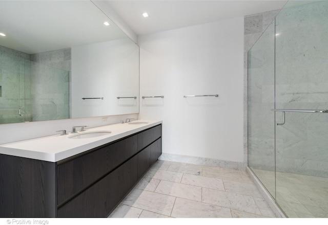 363 E Wacker Dr Unit 1903, Chicago, IL 60601 - bathroom featuring a marble finish shower, double vanity, recessed lighting, and baseboards