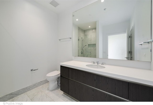 363 E Wacker Dr Unit 1903, Chicago, IL 60601 - bathroom with a marble finish shower, toilet, vanity, recessed lighting, and marble look tile flooring