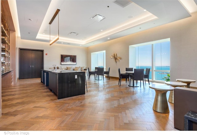 363 E Wacker Dr Unit 1903, Chicago, IL 60601 - kitchen with a tray ceiling, an island with sink, and open floor plan