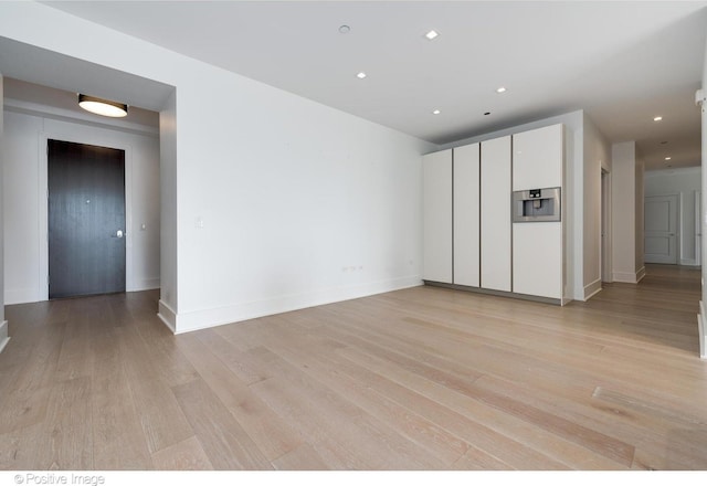 363 E Wacker Dr Unit 1903, Chicago, IL 60601 - unfurnished living room with light wood-type flooring, baseboards, and recessed lighting