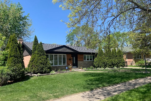 8632 New England Ave, Burbank, IL 60459 - single story home featuring a front lawn, stone siding, and a chimney
