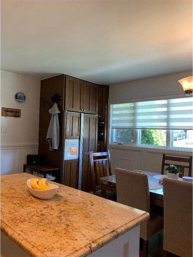8632 New England Ave, Burbank, IL 60459 - kitchen featuring paneled refrigerator, dark brown cabinets, and light stone countertops