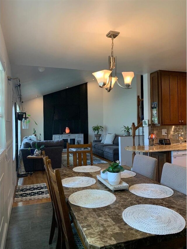 8632 New England Ave, Burbank, IL 60459 - dining space featuring a chandelier, dark wood finished floors, and lofted ceiling
