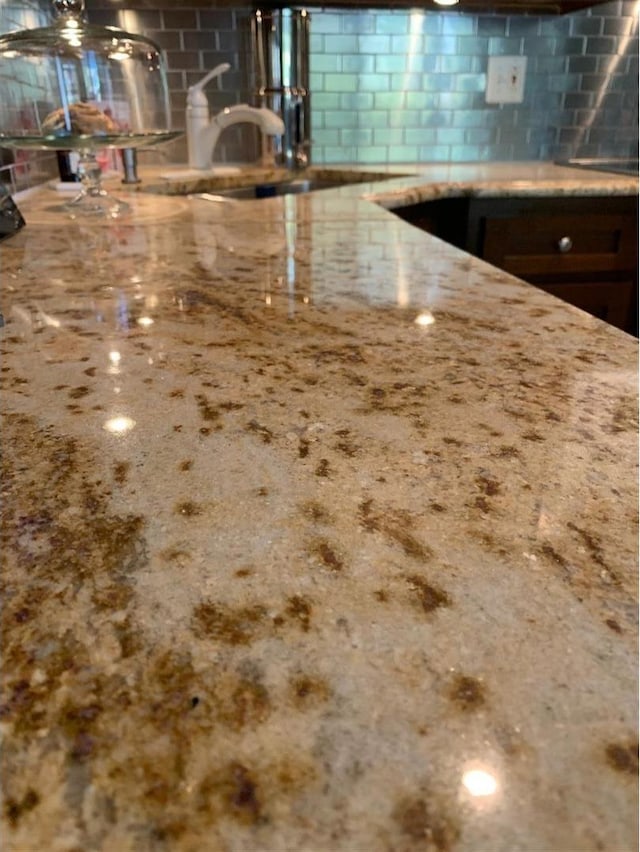 8632 New England Ave, Burbank, IL 60459 - kitchen view of light stone counters and concrete block wall