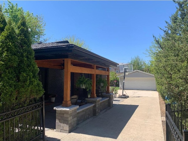 8632 New England Ave, Burbank, IL 60459 - view of patio with a detached garage and an outdoor structure