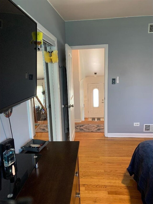 8632 New England Ave, Burbank, IL 60459 - bedroom with light wood finished floors and baseboards