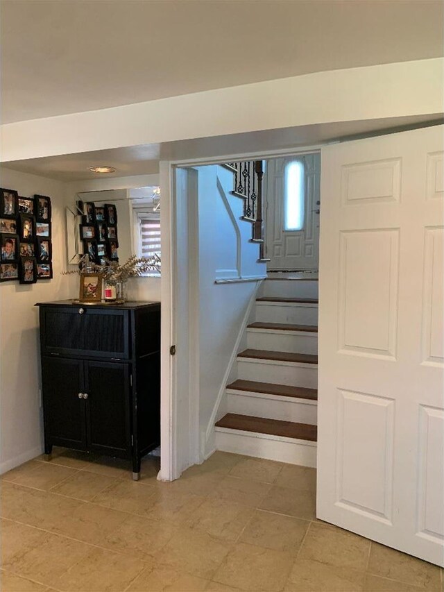 8632 New England Ave, Burbank, IL 60459 - stairway featuring baseboards and a bar