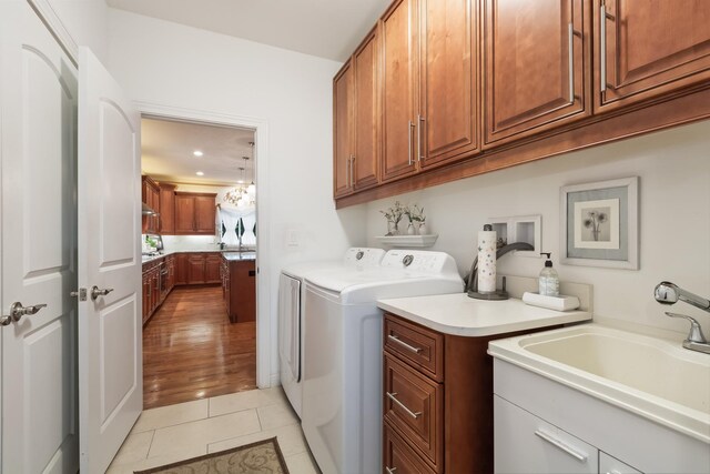 5419 Rita Ave, Crystal Lake, IL 60014 - clothes washing area featuring cabinet space, separate washer and dryer, light tile patterned floors, and recessed lighting