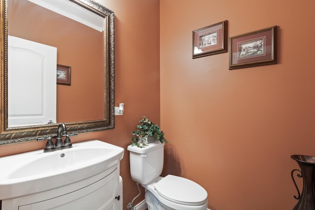 5419 Rita Ave, Crystal Lake, IL 60014 - half bath featuring toilet, vanity, and baseboards