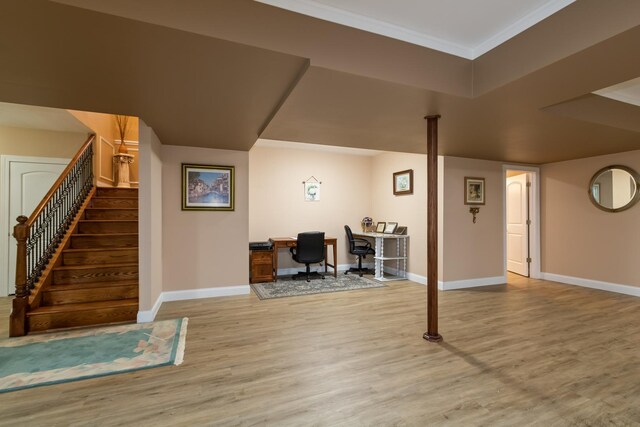 5419 Rita Ave, Crystal Lake, IL 60014 - finished below grade area featuring wood finished floors, baseboards, stairs, crown molding, and a desk