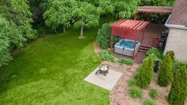 5419 Rita Ave, Crystal Lake, IL 60014 - view of green lawn with a hot tub, a wooden deck, and a fire pit