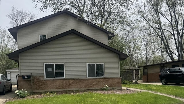 view of home's exterior featuring brick siding