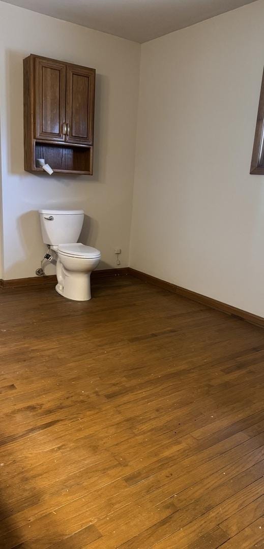 331 Somonauk St, Park Forest, IL 60466 - bathroom featuring baseboards, wood finished floors, and toilet