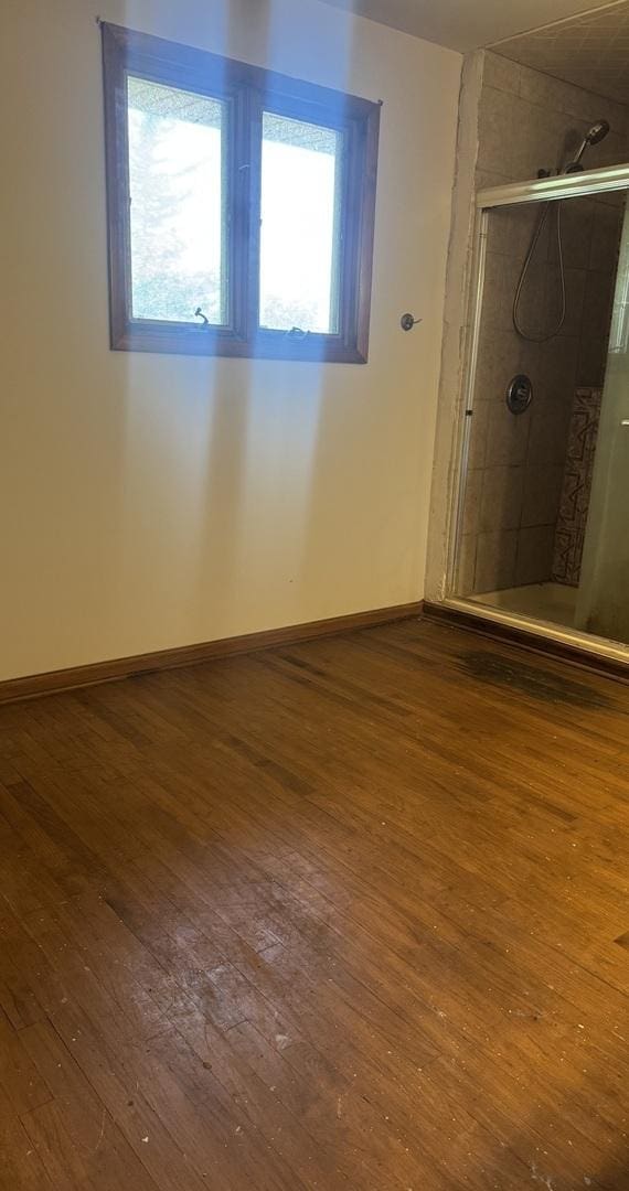 331 Somonauk St, Park Forest, IL 60466 - full bath featuring wood-type flooring, a stall shower, and baseboards
