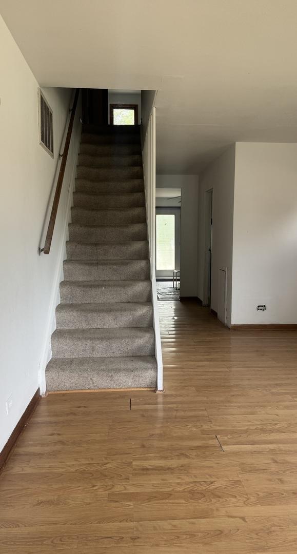 331 Somonauk St, Park Forest, IL 60466 - stairs featuring baseboards and wood finished floors