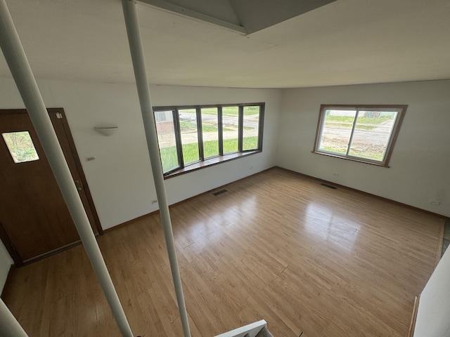 331 Somonauk St, Park Forest, IL 60466 - unfurnished room featuring wood finished floors and lofted ceiling