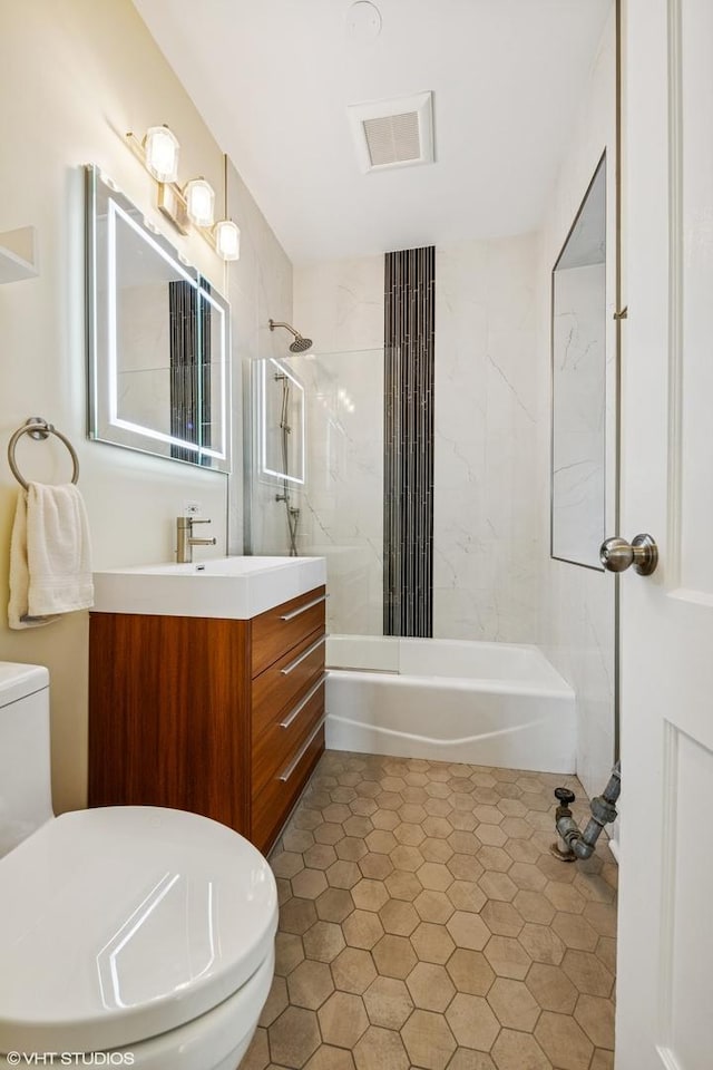 full bath featuring toilet, tub / shower combination, and vanity