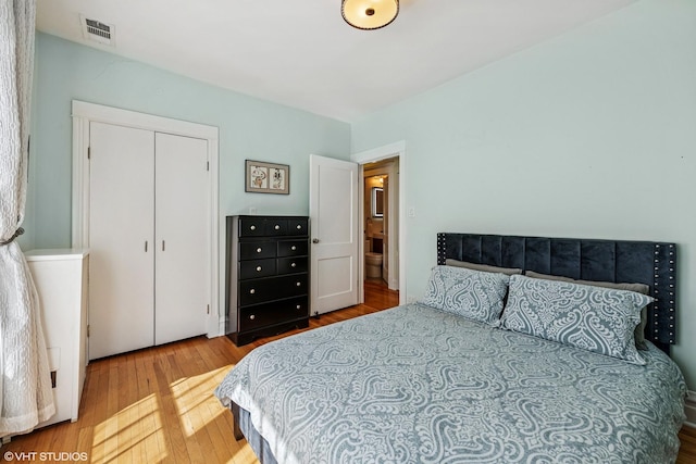bedroom featuring wood finished floors and a closet