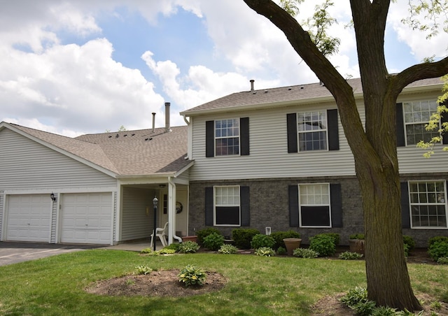 378 Wilmington Dr Unit B1, Bartlett, IL 60103 - view of front of house with an attached garage, driveway, a front yard, and roof with shingles