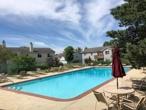 378 Wilmington Dr Unit B1, Bartlett, IL 60103 - community pool featuring a patio