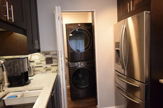 378 Wilmington Dr Unit B1, Bartlett, IL 60103 - clothes washing area featuring stacked washer / drying machine and wood finished floors