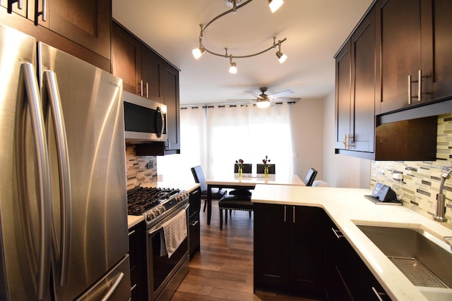 378 Wilmington Dr Unit B1, Bartlett, IL 60103 - kitchen featuring stainless steel appliances, ceiling fan, a sink, and tasteful backsplash