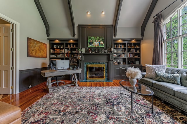 9430 Reserve Dr, Caledonia, IL 61011 - living room with a premium fireplace, wood finished floors, and a wainscoted wall