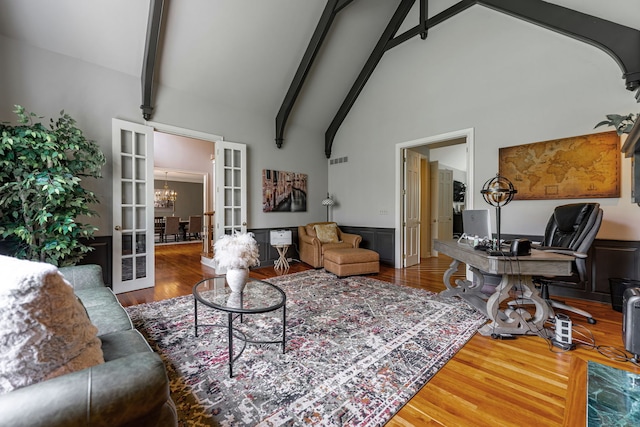 9430 Reserve Dr, Caledonia, IL 61011 - living area featuring wood finished floors, high vaulted ceiling, beamed ceiling, a chandelier, and french doors