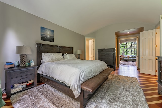 9430 Reserve Dr, Caledonia, IL 61011 - bedroom featuring wood finished floors, lofted ceiling, and arched walkways