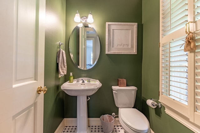 9430 Reserve Dr, Caledonia, IL 61011 - half bath featuring plenty of natural light, baseboards, and toilet