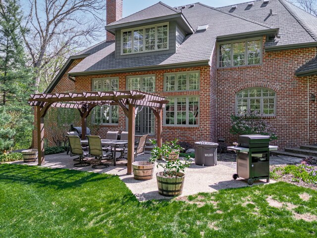 9430 Reserve Dr, Caledonia, IL 61011 - rear view of property featuring a pergola, brick siding, a chimney, a patio, and a yard
