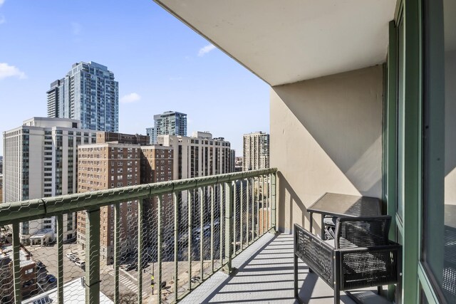 balcony featuring a view of city