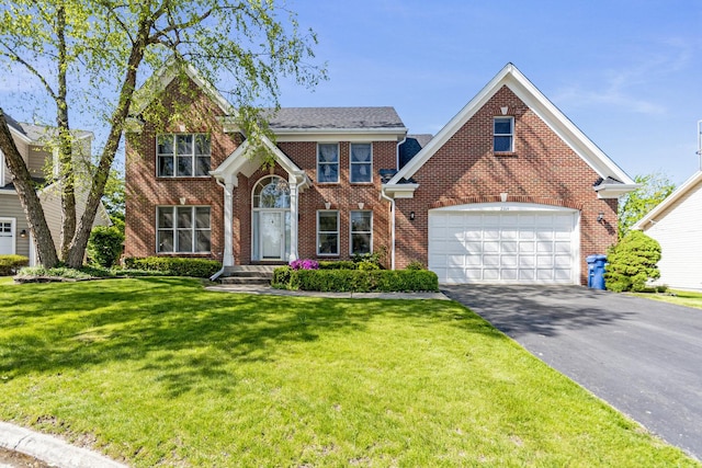 2164 Tellis Ln, Lisle, IL 60532 - traditional-style house featuring asphalt driveway, brick siding, and a front yard