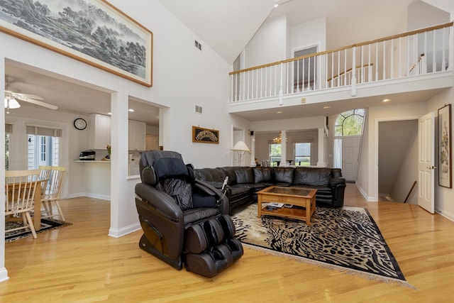 2164 Tellis Ln, Lisle, IL 60532 - living area with wood finished floors, ceiling fan, baseboards, and high vaulted ceiling