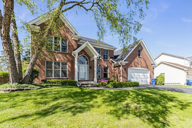 2164 Tellis Ln, Lisle, IL 60532 - traditional home with brick siding, asphalt driveway, an attached garage, and a front yard