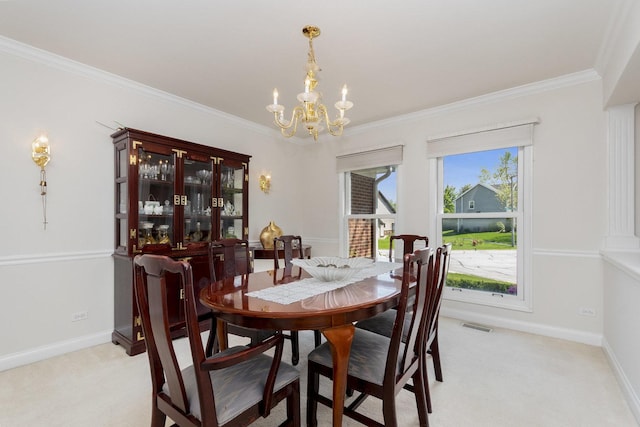 2164 Tellis Ln, Lisle, IL 60532 - dining area featuring a chandelier, light carpet, crown molding, and baseboards