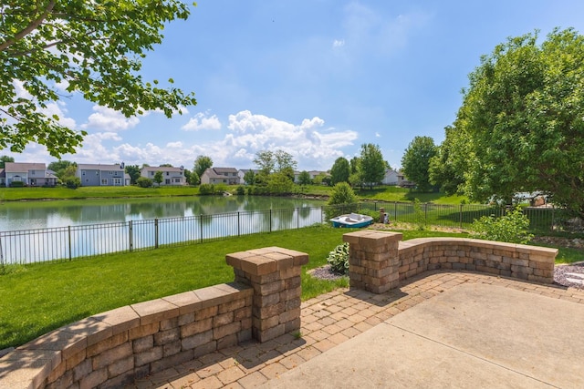 view of patio / terrace featuring a water view and a residential view