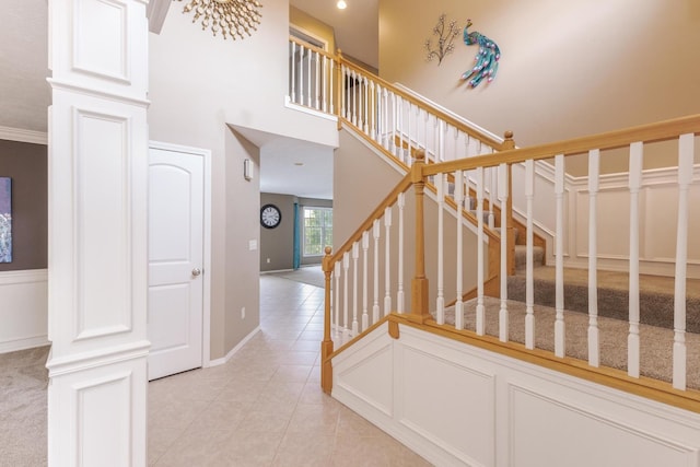 stairway with tile patterned flooring and baseboards