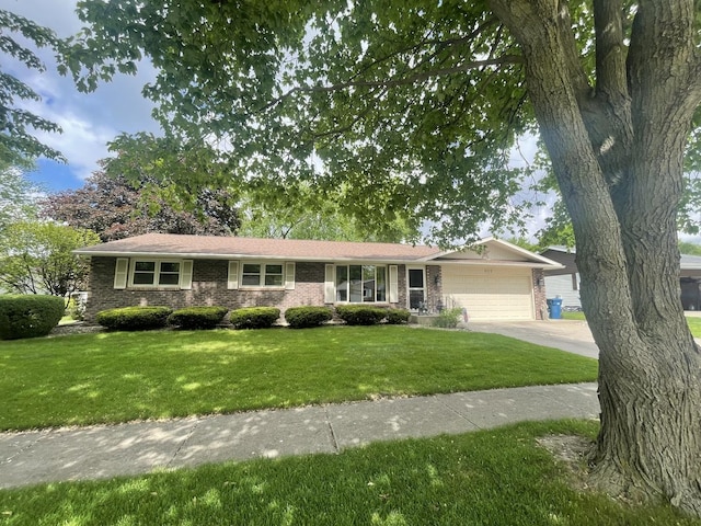809 Stonewall Dr, Bourbonnais, IL 60914 - ranch-style house featuring an attached garage, brick siding, a front yard, and driveway