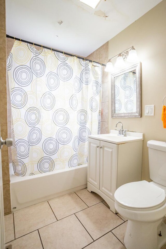 9226 S Ellis Ave, Chicago, IL 60619 - bathroom featuring tile patterned floors, toilet, shower / tub combo with curtain, and vanity